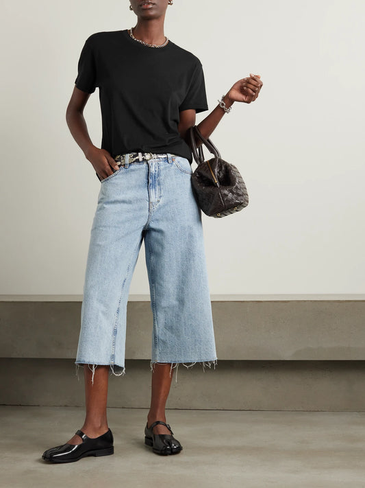 Image of a model wearing Tops. Product name - Boyfriend Cotton And Modal-blend Jersey T-shirt in Black colour by brand - ÉTERNE