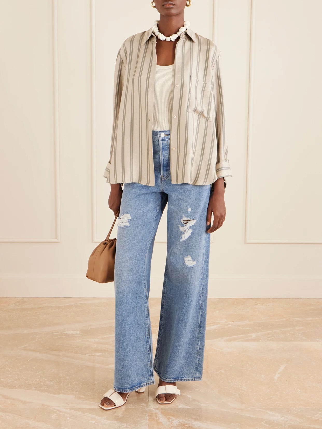 Image of Jeans. Product name - Low Slung Relaxed Wide Distressed Low-rise Wide-leg Jeans in Blue colour by brand - FRAME