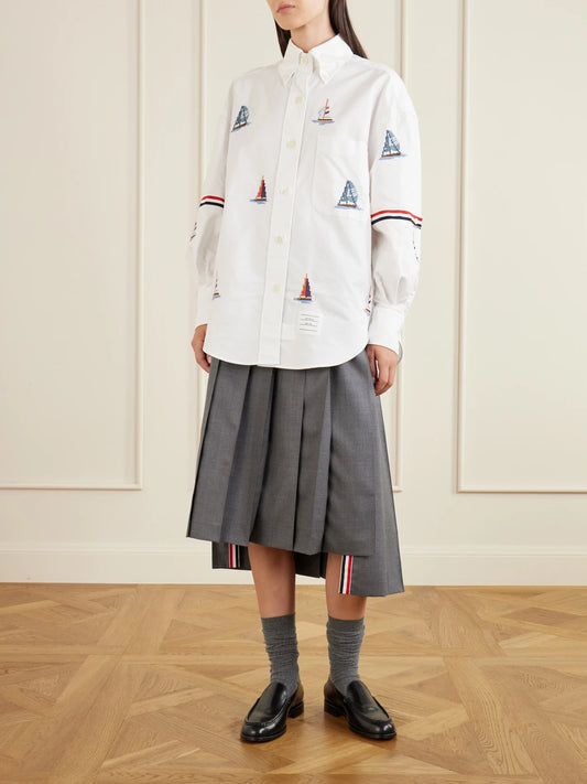 Image of a model wearing Tops. Product name - Embroidered Cotton Shirt in White colour by brand - Thom Browne