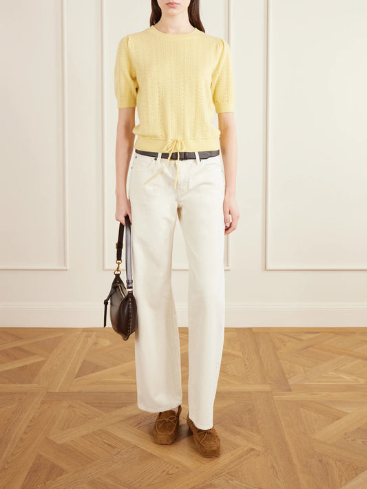 Image of a model wearing Outerwear. Product name - Charm Knitted Cashmere Sweater in Yellow colour by brand - FRAME
