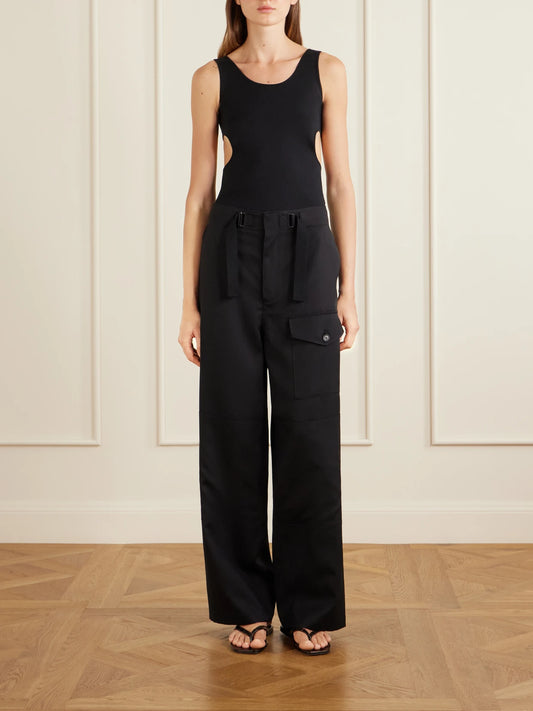 Image of a model wearing Tops. Product name - Cutout Ribbed-knit Jersey Tank in Black colour by brand - Auralee