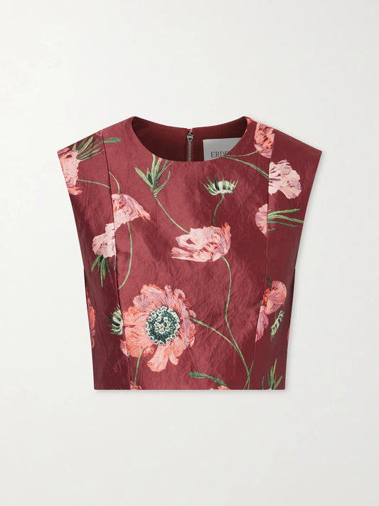 Image of a model wearing Tops. Product name - Floral-print Crinkled Satin Cropped Top in Burgundy colour by brand - Erdem