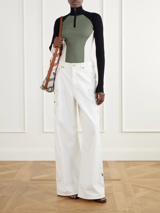 Image of a model wearing Outerwear. Product name - Clash Ribbed Jersey Half-zip Sweater in Green colour by brand - Zimmermann