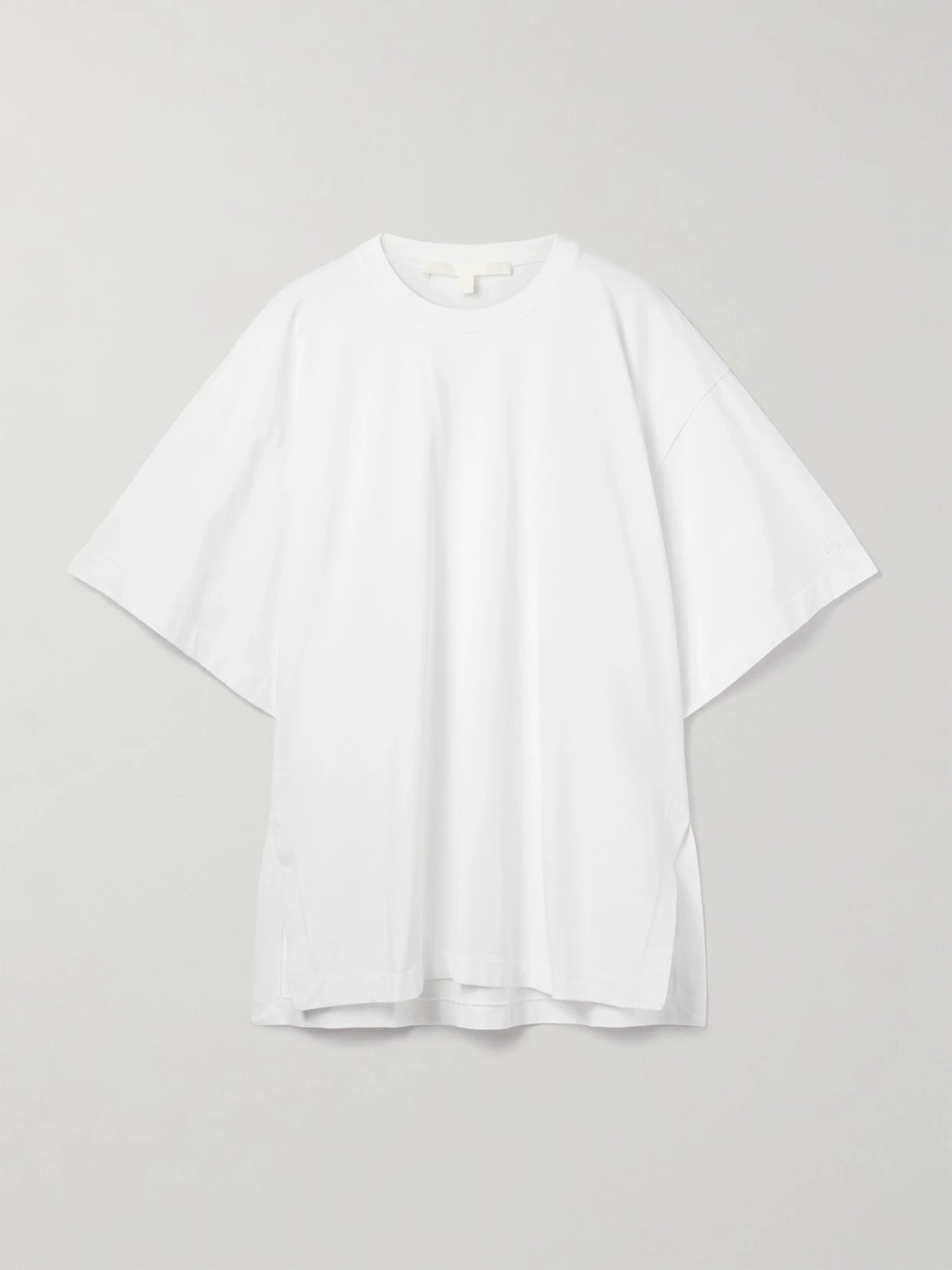 Image of a model wearing Tops. Product name - The Holt Oversized Organic Cotton-jersey T-shirt in White colour by brand - RÙADH