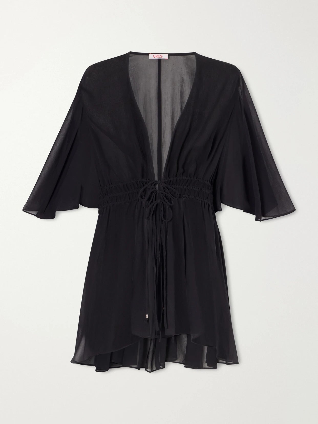 Image of a model wearing Tops. Product name - Midnight Operette Shirred Muslin Blouse in Black colour by brand - Eres