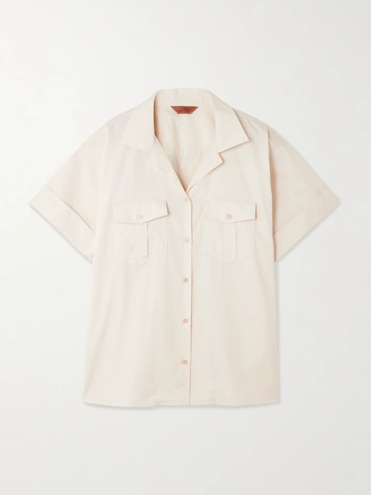Image of a model wearing Tops. Product name - The Safari Cotton Shirt in Ecru colour by brand - Jamie Haller
