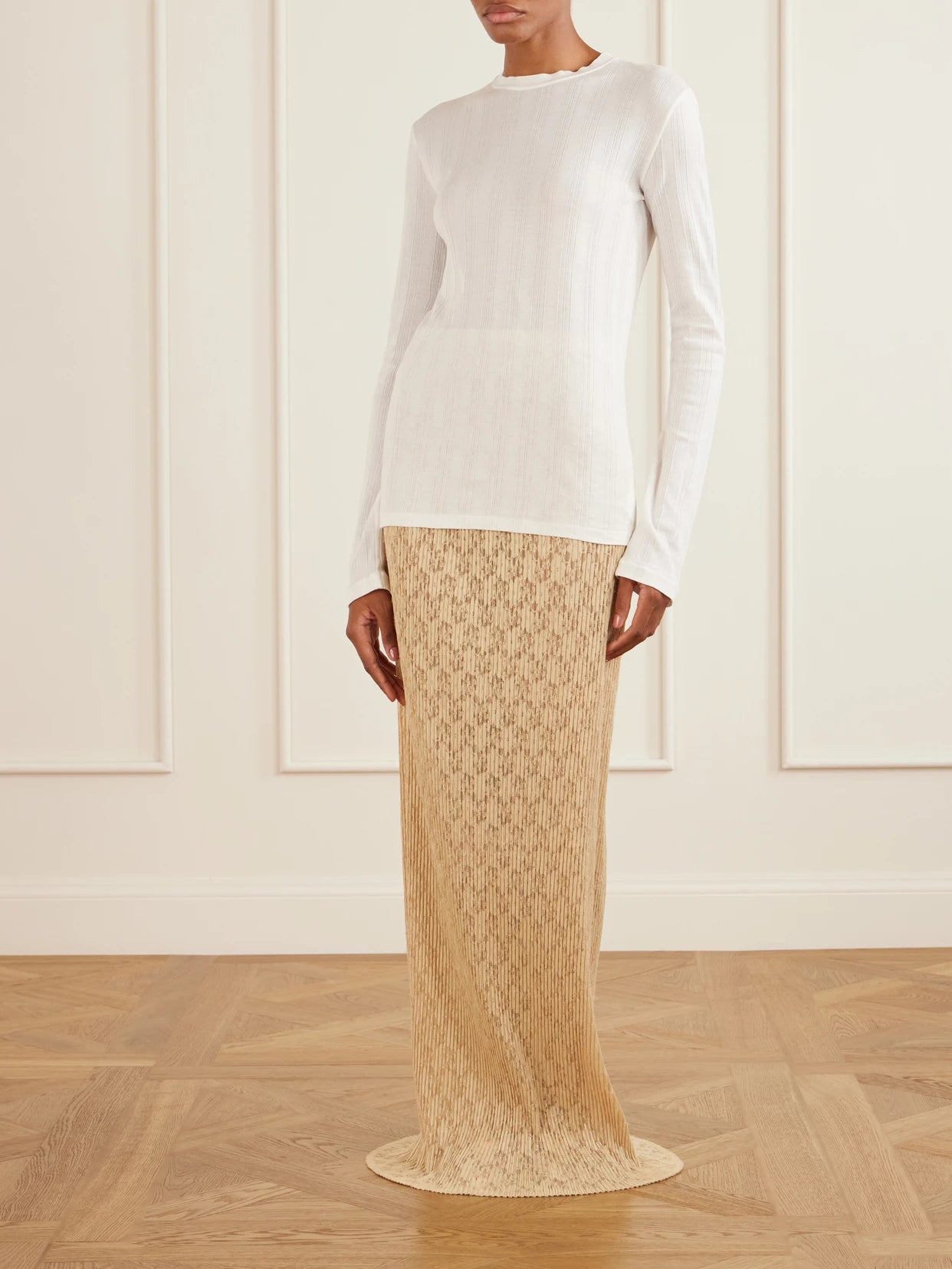 Image of a model wearing Skirts. Product name - Bandi Lace Maxi Skirt in Cream colour by brand - The Row