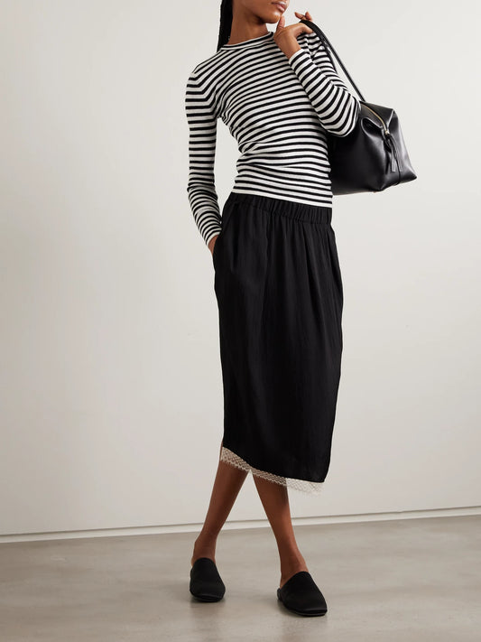 Image of a model wearing Outerwear. Product name - Vivian Striped Ribbed Cotton And Cashmere-blend Top in Black colour by brand - LISA YANG