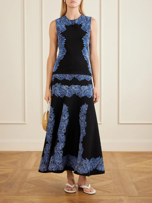 Image of a model wearing Skirts. Product name - Alessia Jacquard-knit Midi Skirt in Navy colour by brand - Ulla Johnson