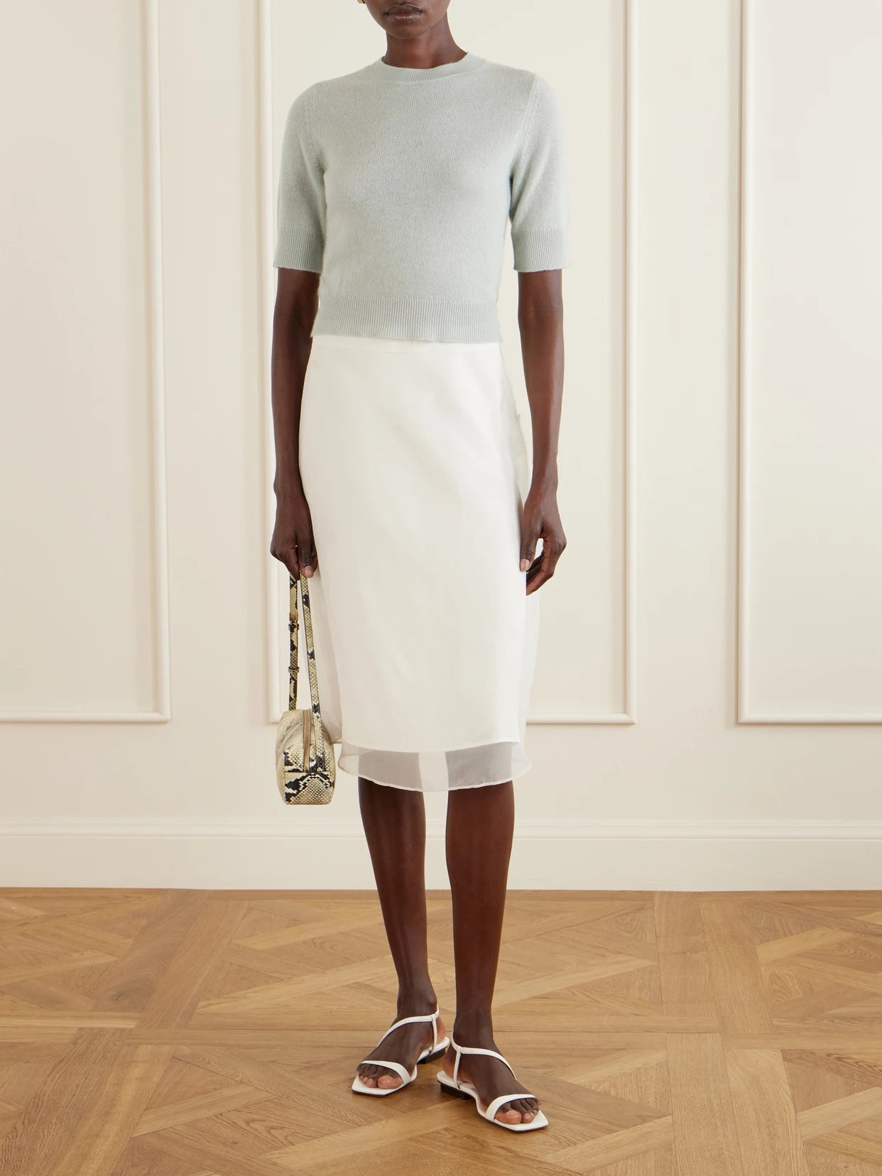 Image of a model wearing Outerwear. Product name - Chypre Organic Cashmere T-shirt in Light green colour by brand - Le Kasha