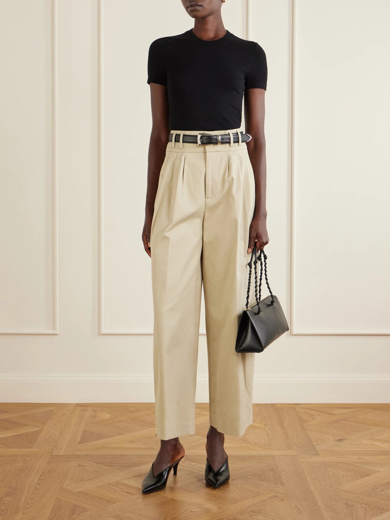 Image of a model wearing Tops. Product name - Manny Woven T-shirt in Black colour by brand - Altuzarra