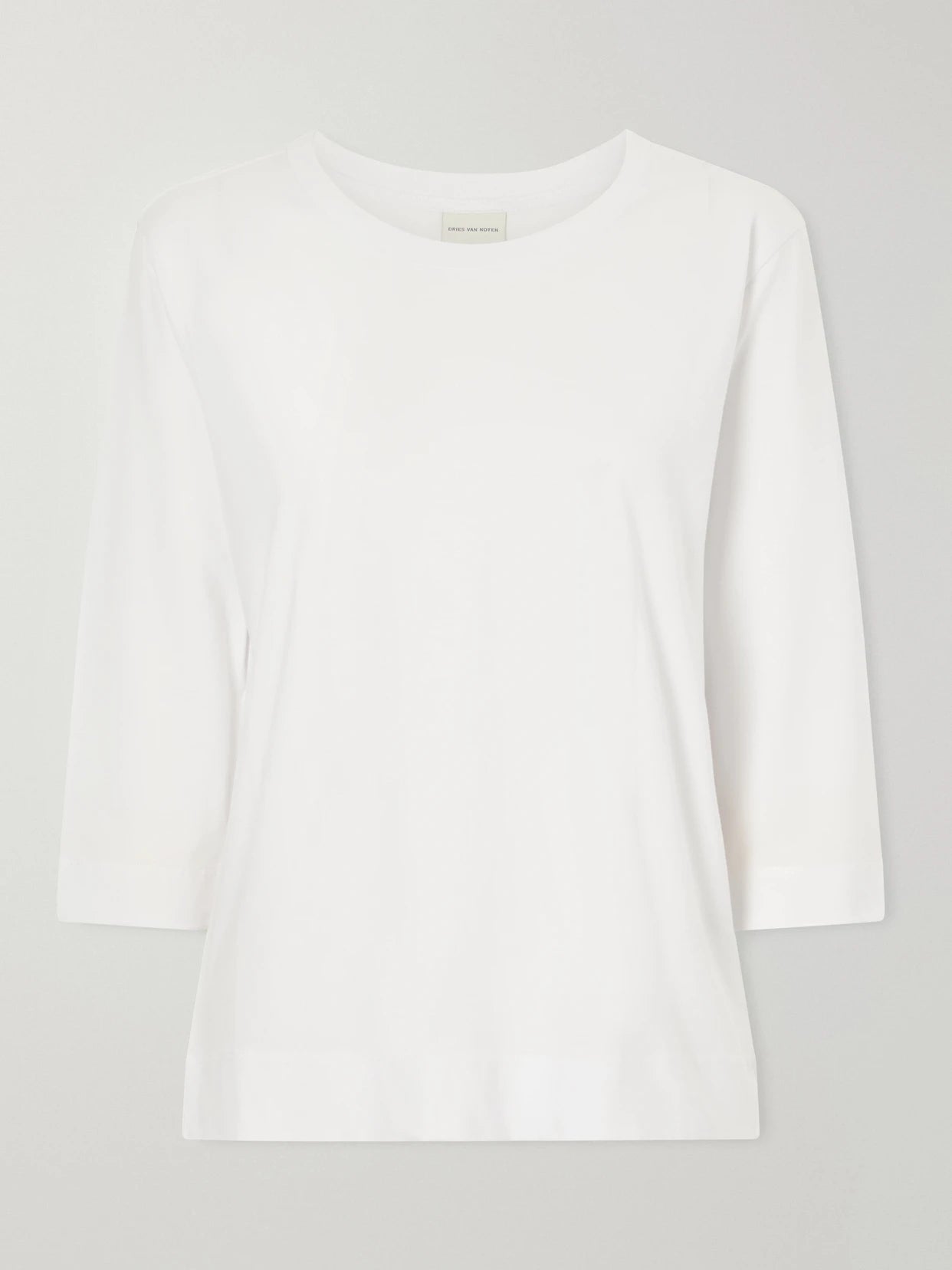 Image of a model wearing Tops. Product name - Cotton T-shirt in White colour by brand - Dries Van Noten