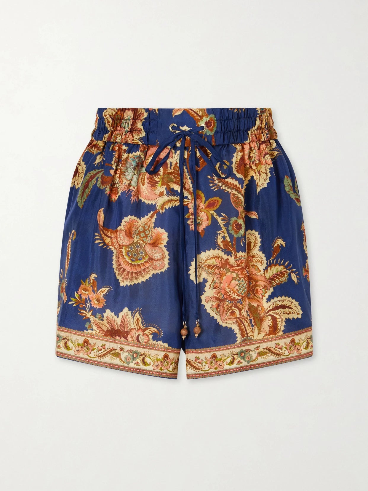 Image of a model wearing Shorts. Product name - Aster Printed Silk Shorts in Navy colour by brand - Zimmermann