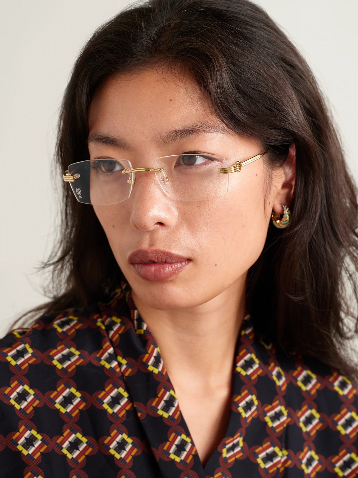 Image of Accessories. Product name - Première De Cartier Rimless Rectangle-frame Gold-tone Optical Glasses in Multi colour by brand - Cartier Eyewear
