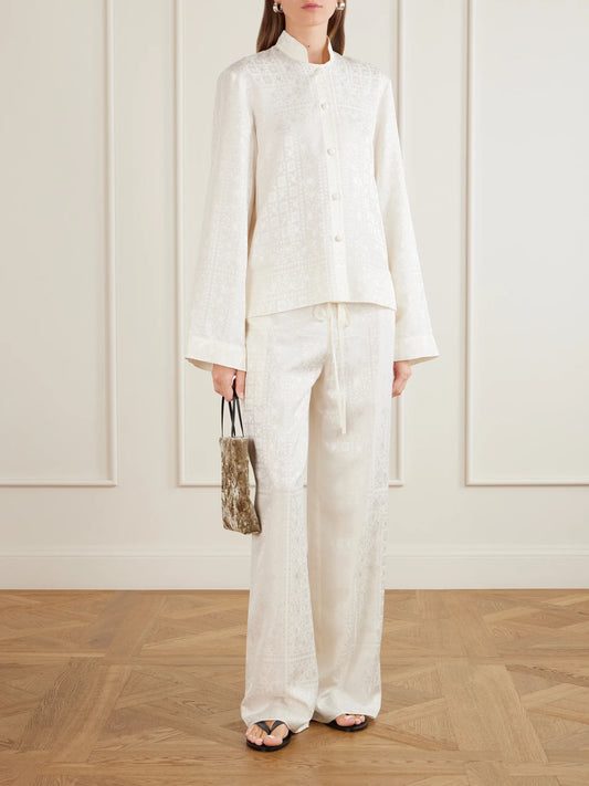 Image of a model wearing Pants. Product name - Silk-jacquard Wide-leg Pants in Ivory colour by brand - LIBEROWE