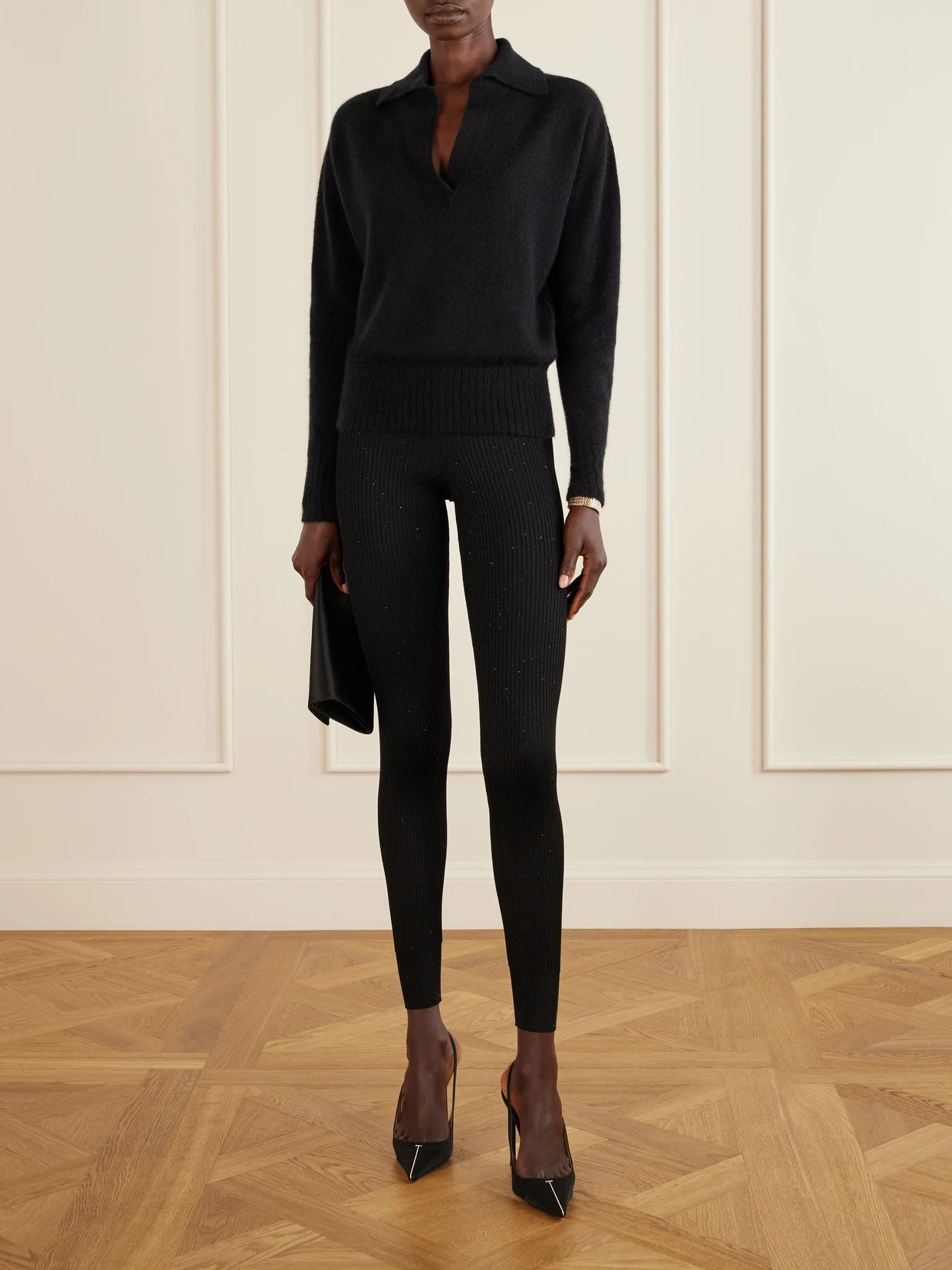 Image of a model wearing Outerwear. Product name - Ribbed Cashmere And Silk-blend Knitted Polo Shirt in Black colour by brand - TOM FORD