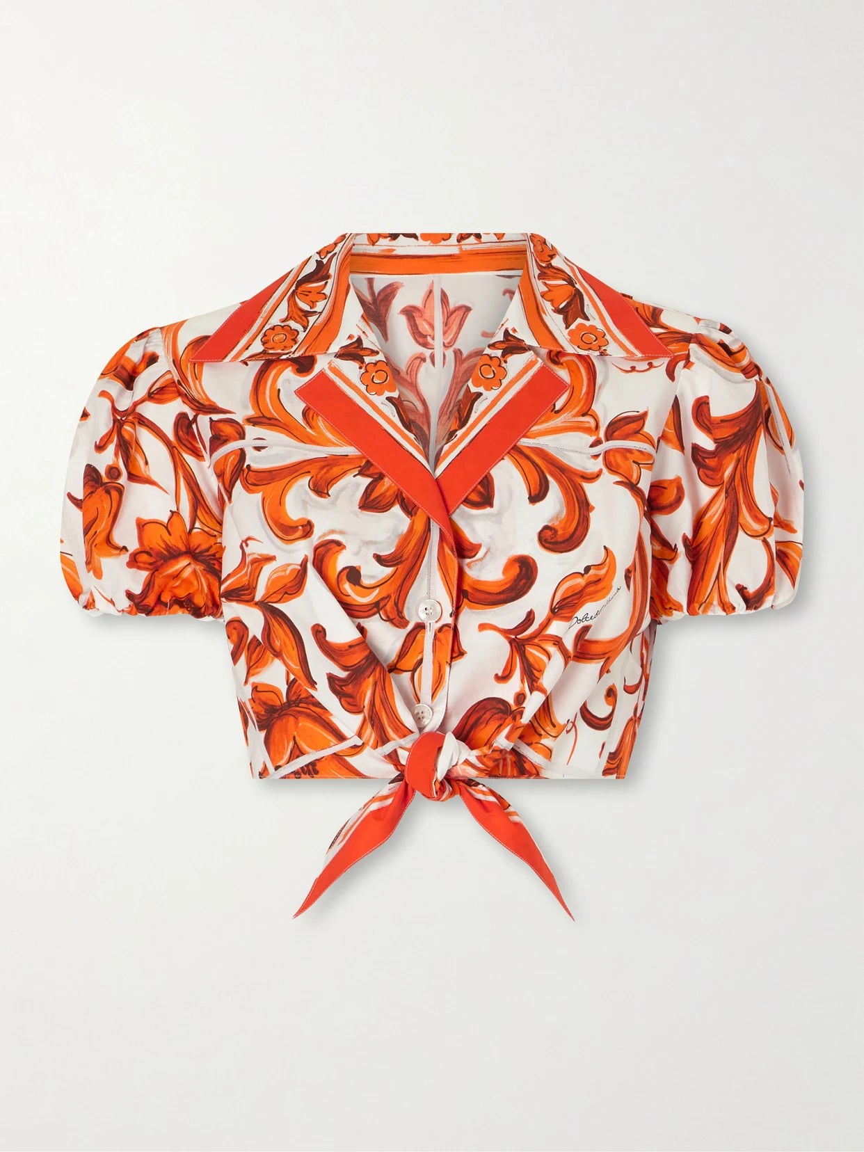 Image of a model wearing Tops. Product name - Cropped Printed Cotton-poplin Top in Orange colour by brand - Dolce & Gabbana
