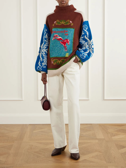Image of a model wearing Outerwear. Product name - Lasso Embroidered Merino Wool Sweater in Brown colour by brand - ALÉMAIS