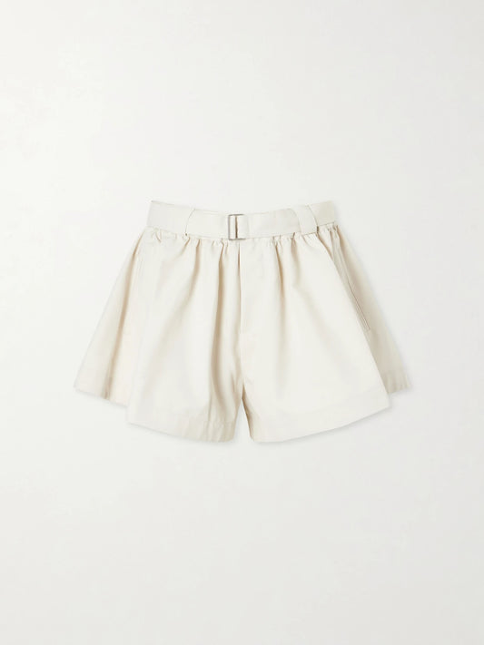 Image of a model wearing Shorts. Product name - Angelina Belted Pleated Woven Shorts in Cream colour by brand - Sea