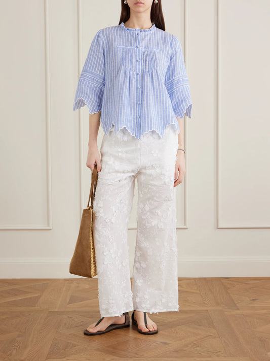Image of a model wearing Pants. Product name - Speranza Embroidered Fil-coupé Cotton Straight-leg Pants in White colour by brand - Loretta Caponi