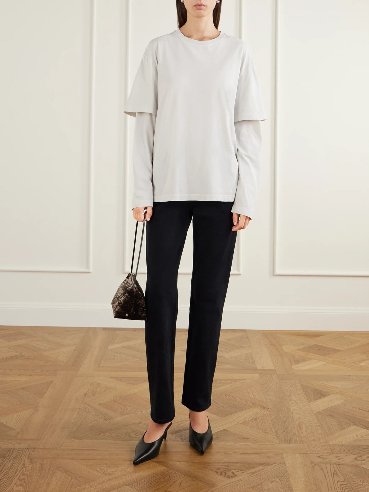 Image of a model wearing Tops. Product name - Lois Layered Cotton-jersey T-shirt in Cream colour by brand - AGOLDE