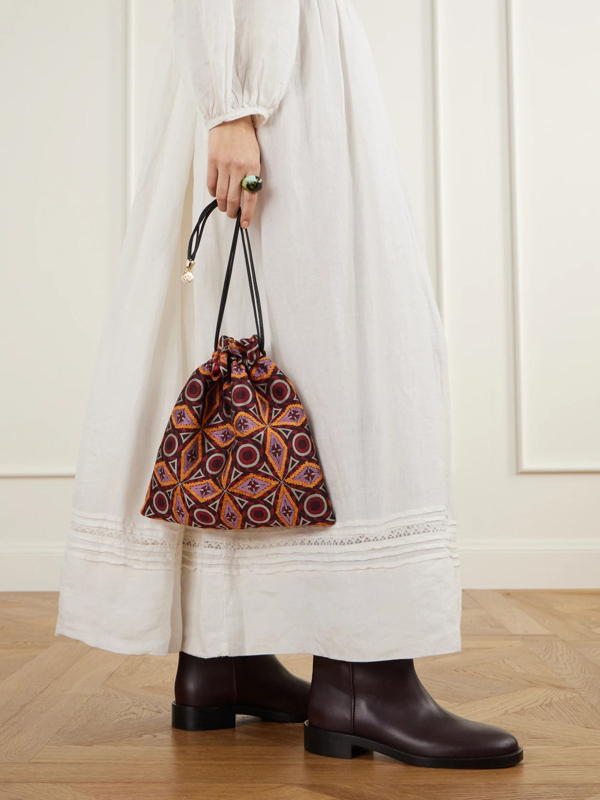 Image of Bags. Product name - Drawstring Leather-trimmed Jacquard-knit Clutch in Magenta colour by brand - La DoubleJ