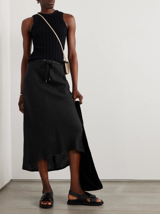 Image of a model wearing Skirts. Product name - Surfside Asymmetric Linen Skirt in Black colour by brand - James Perse