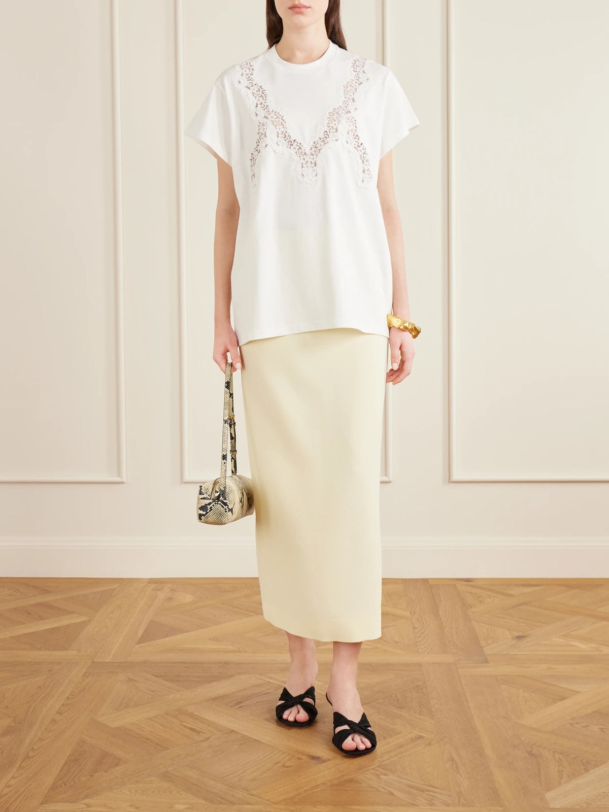 Image of a model wearing Tops. Product name - Lace-trimmed Cotton-jersey T-shirt in White colour by brand - Stella McCartney