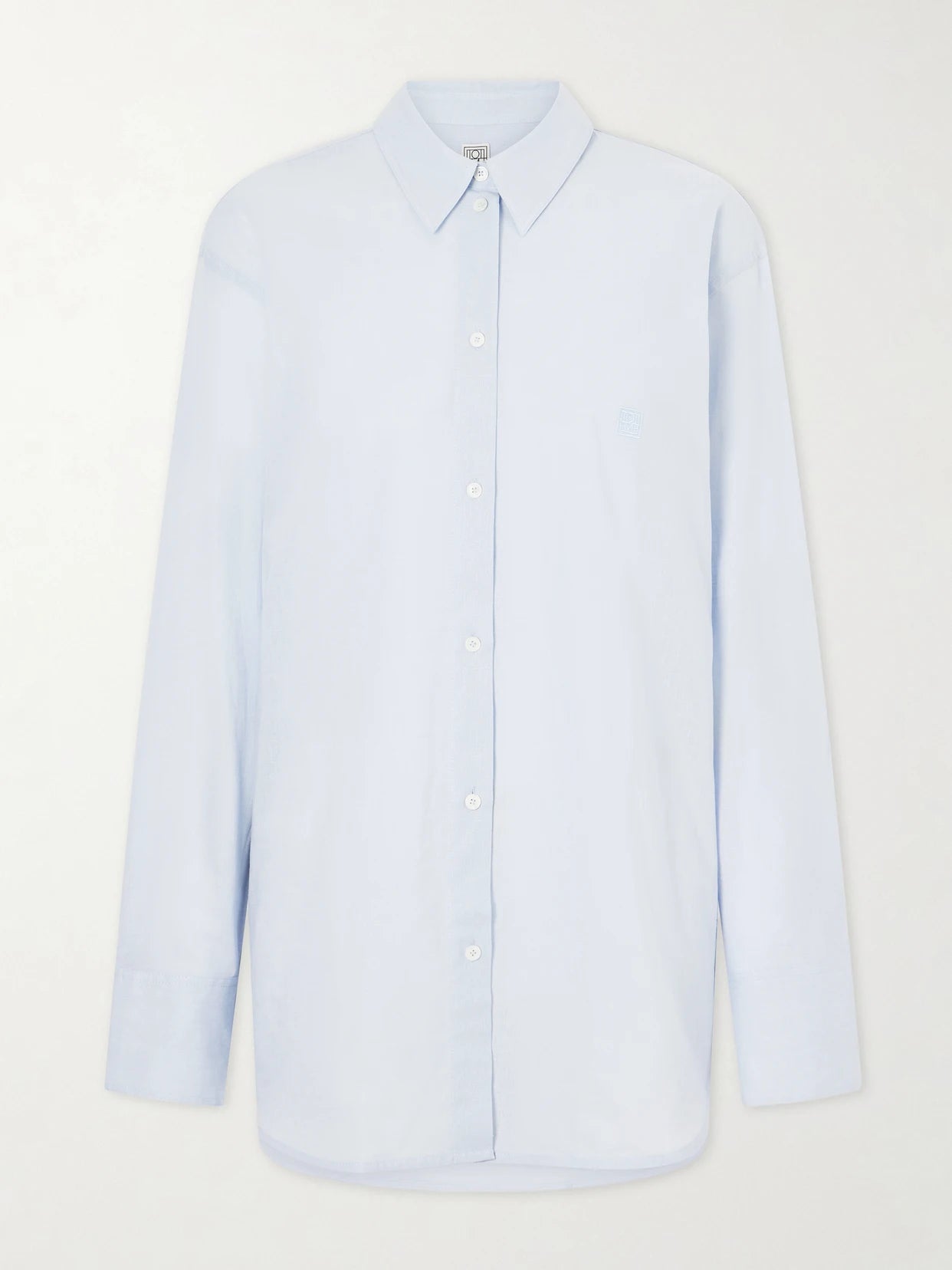 Image of a model wearing Tops. Product name - Cotton And Linen-blend Shirt in Light blue colour by brand - TOTEME