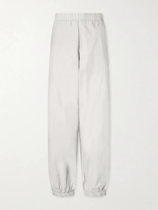 Image of a model wearing Pants. Product name - Cotton-blend Poplin Balloon Pants in Off-white colour by brand - James Perse