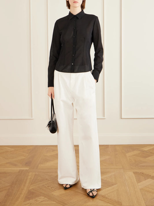 Image of a model wearing Tops. Product name - Wool Shirt in Black colour by brand - Jil Sander