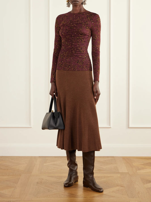 Image of a model wearing Tops. Product name - Asha Ruched Floral-print Jersey Top in Claret colour by brand - Ulla Johnson