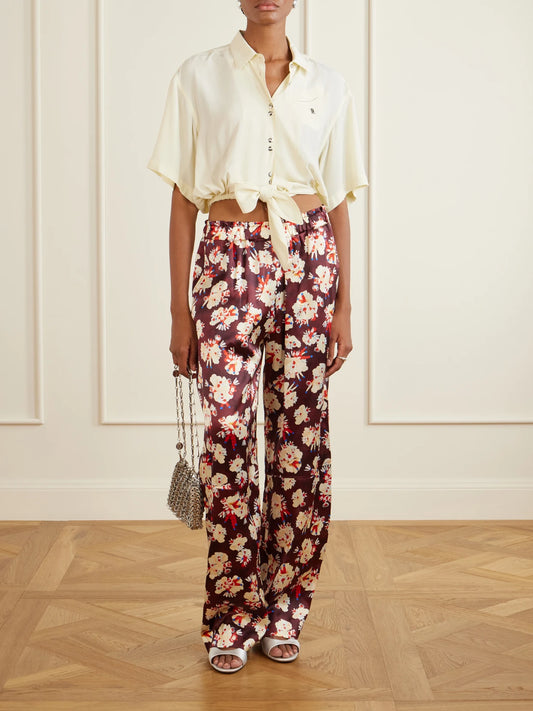 Image of a model wearing Pants. Product name - Floral-print Wide-leg Silk Pants in Burgundy colour by brand - RABANNE
