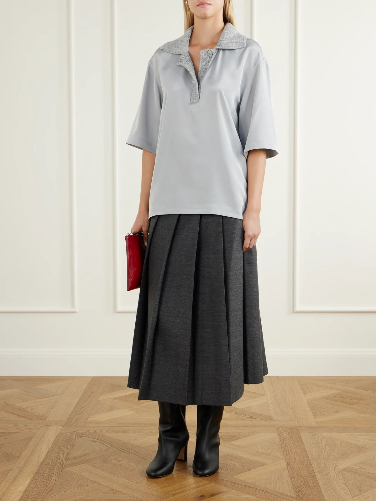 Image of a model wearing Tops. Product name - Stretch Silk-blend Polo Shirt in Gray colour by brand - Tibi