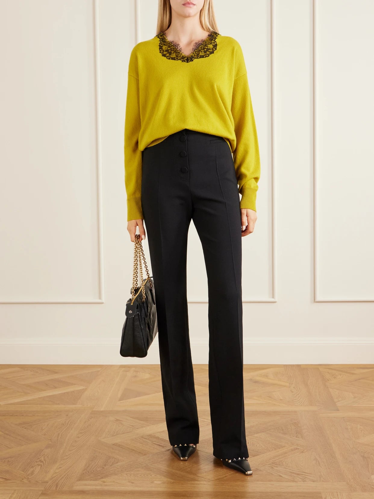 Image of a model wearing Pants. Product name - Straight-leg Wool Crepe Pants in Black colour by brand - Valentino Garavani