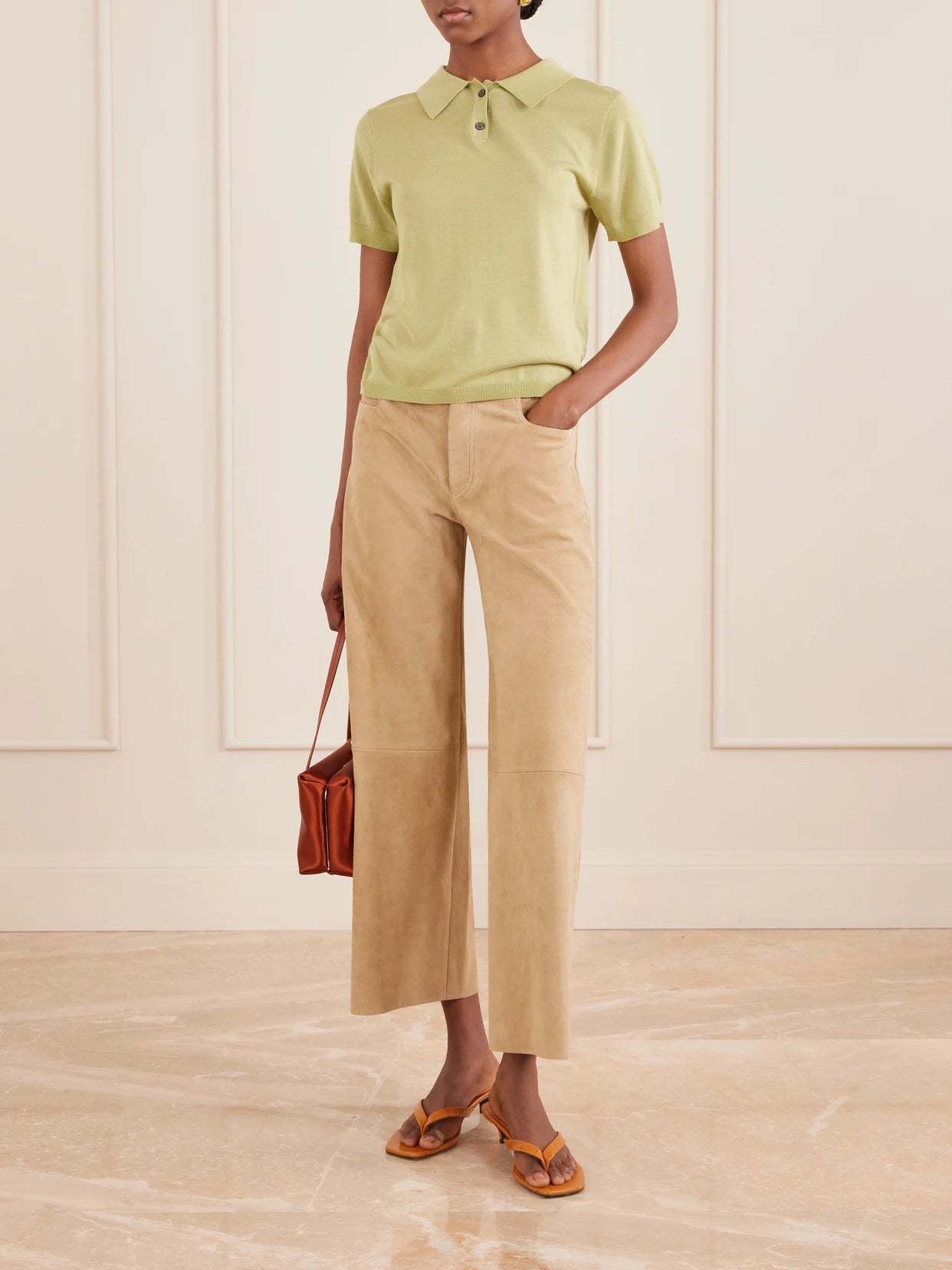 Image of a model wearing Pants. Product name - Lilou Cropped Suede Wide-leg Pants in Beige colour by brand - STOULS