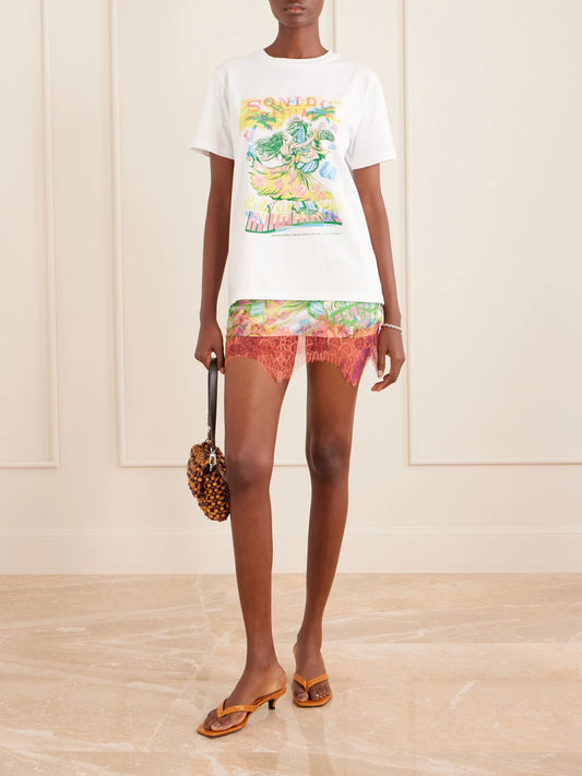 Image of a model wearing Skirts. Product name - Sonido Bestial Lace-trimmed Printed Satin Mini Skirt in Multi colour by brand - Donde Esteban