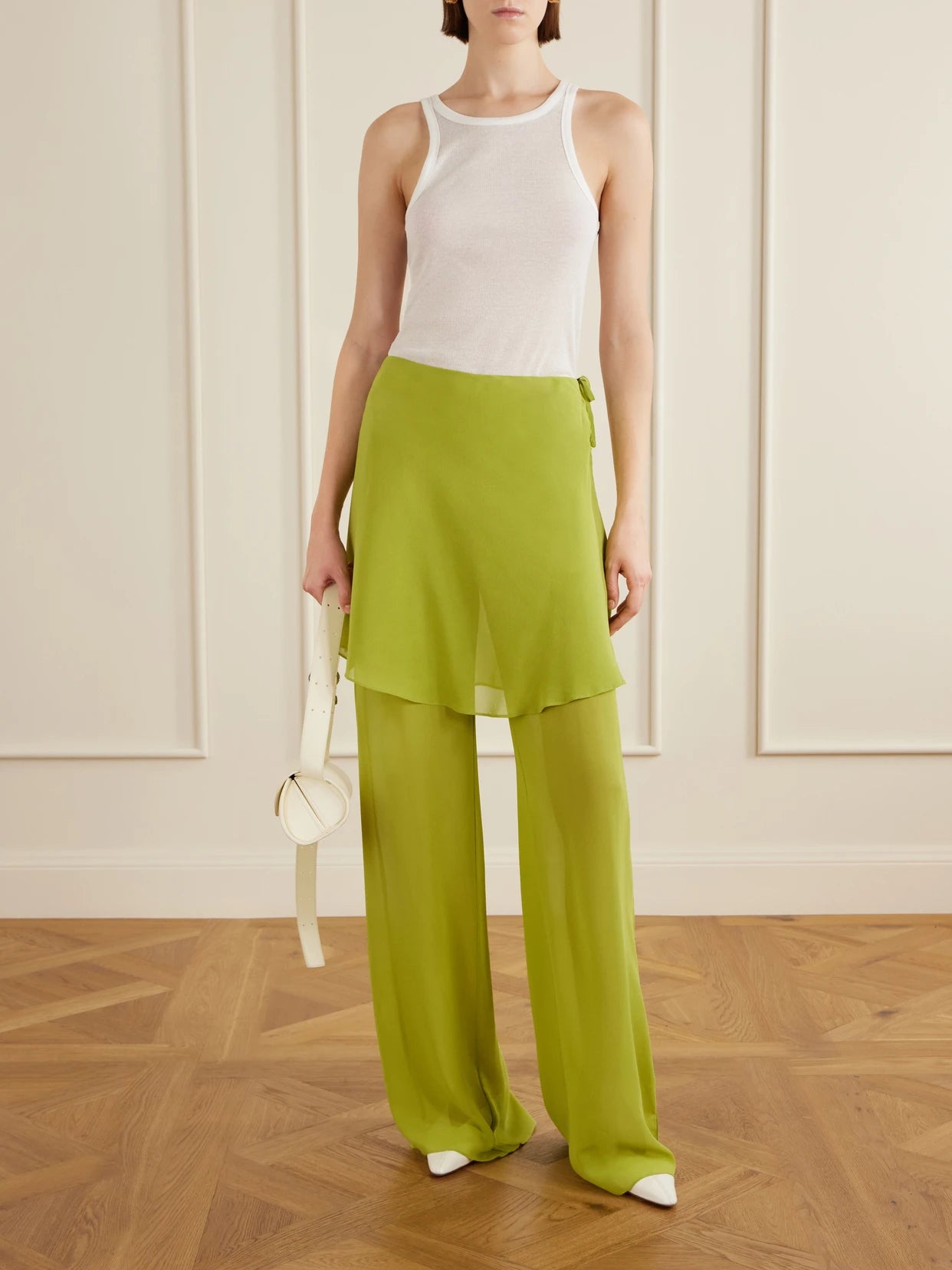 Image of a model wearing Pants. Product name - Mirador Silk Wide-leg Pants in Green colour by brand - Christopher Esber
