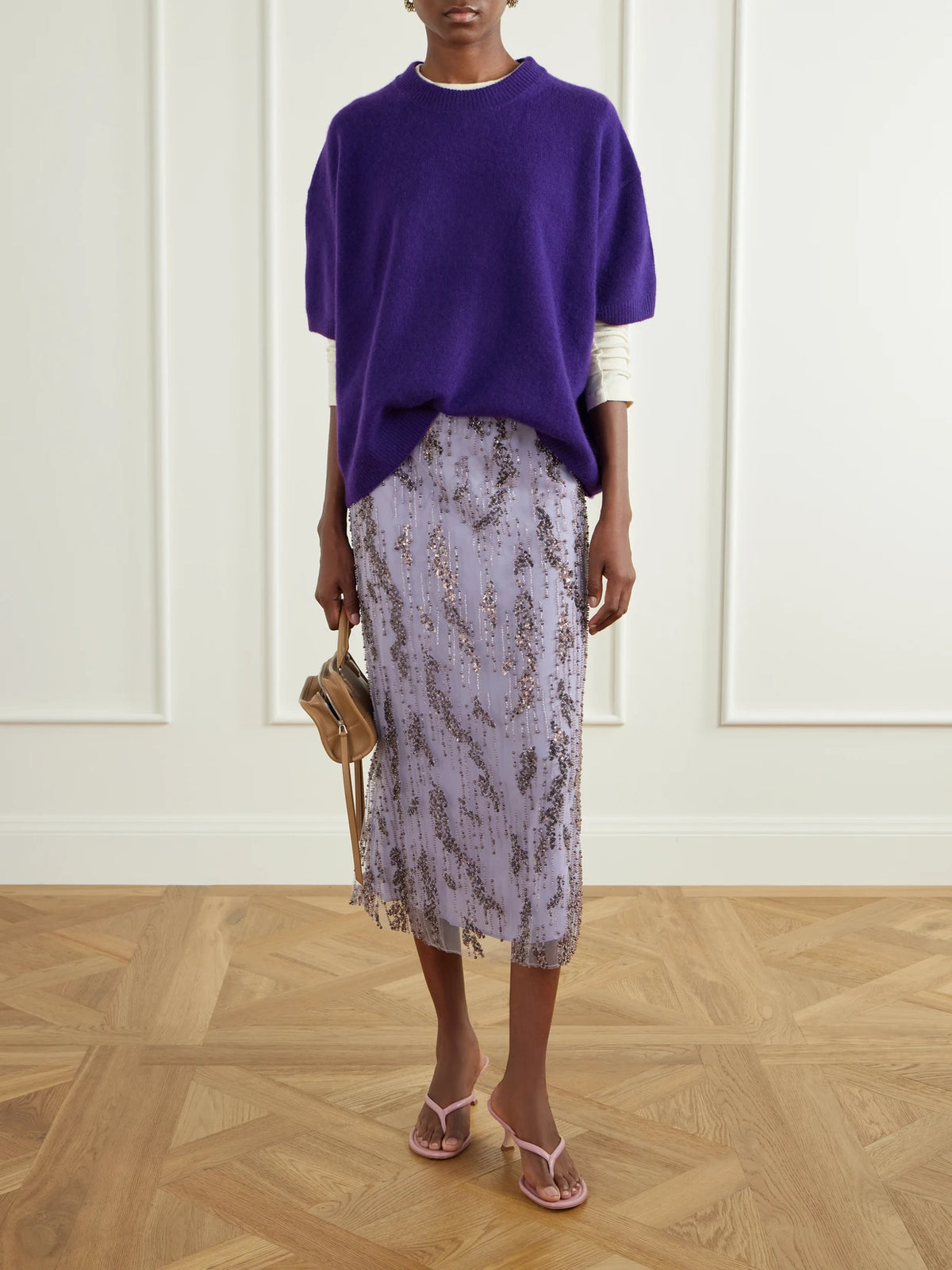 Image of a model wearing Skirts. Product name - Bead-embellished Midi Skirt in Lilac colour by brand - STAUD