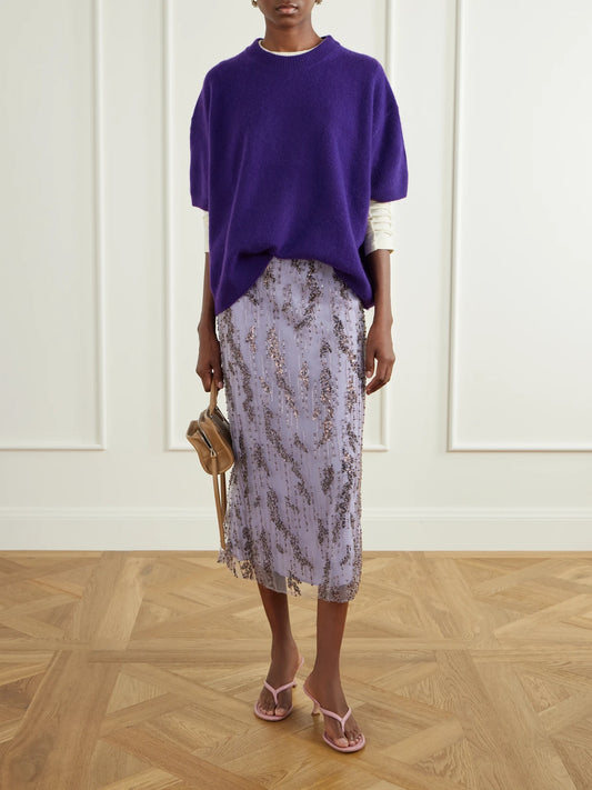 Image of a model wearing Skirts. Product name - Bead-embellished Midi Skirt in Lilac colour by brand - STAUD