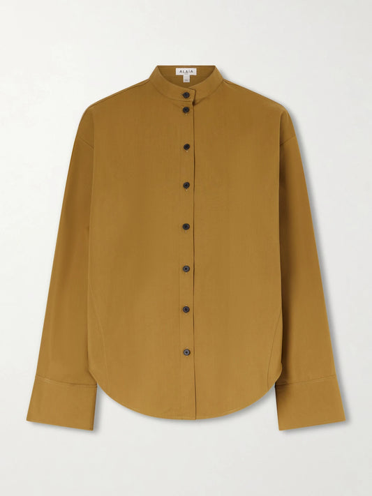 Image of a model wearing Tops. Product name - Oversized Cotton-poplin Shirt in Brown colour by brand - Alaïa