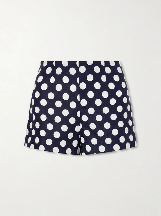 Image of a model wearing Shorts. Product name - Lila Polka-dot Linen Shorts in Navy colour by brand - Faithfull