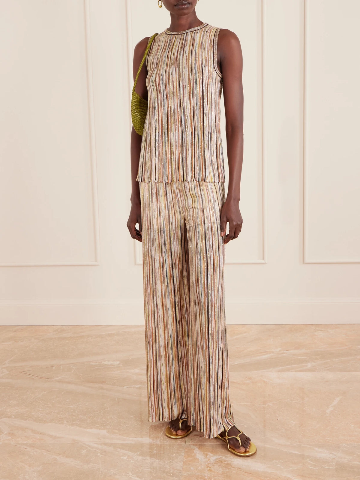 Image of a model wearing Pants. Product name - Mare Embellished Metallic Crochet-knit Wide-leg Pants in Brown colour by brand - Missoni