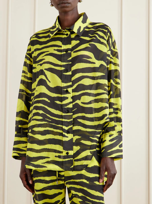 Image of a model wearing Tops. Product name - Asymmetric Animal-print Cotton Shirt in Yellow colour by brand - The Attico