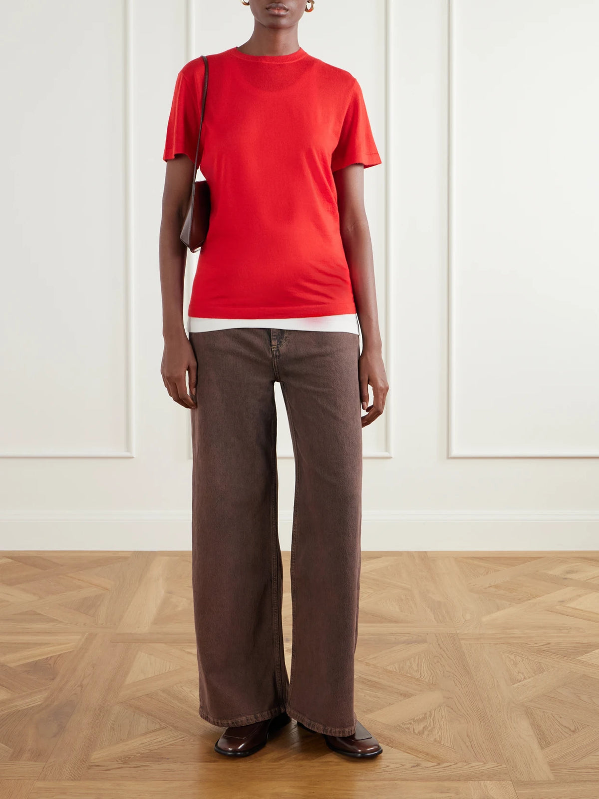 Image of a model wearing Outerwear. Product name - Knitted Cashmere T-shirt in Red colour by brand - Co