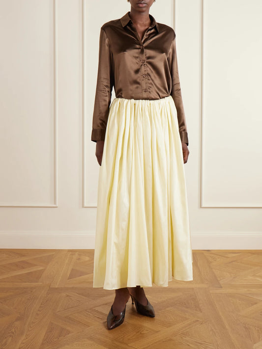 Image of a model wearing Skirts. Product name - Elodie Pleated Duchess-satin Midi Skirt in Cream, Red colour by brand - Abadia