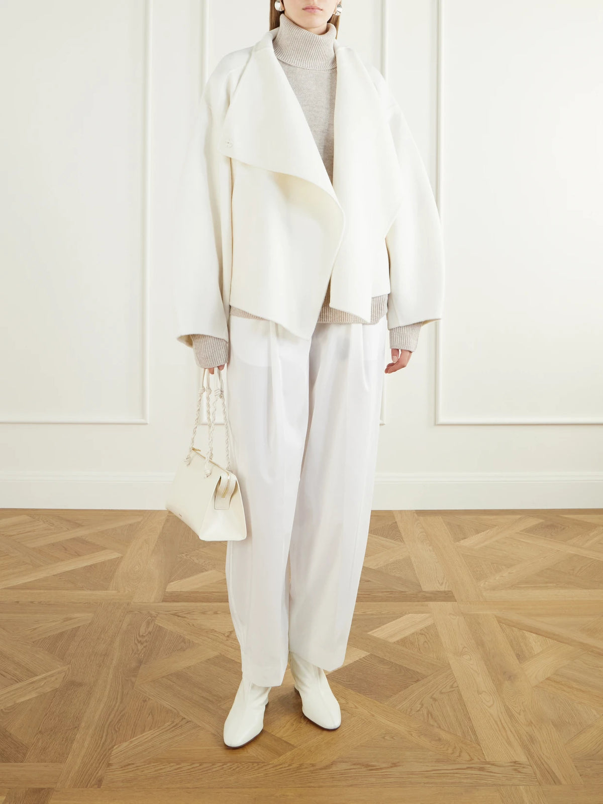 Image of a model wearing Outerwear. Product name - Gala Merino Wool And Cashmere-blend Turtleneck Sweater in Beige, Blue colour by brand - The Frankie Shop