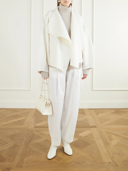 Image of a model wearing Outerwear. Product name - Gala Merino Wool And Cashmere-blend Turtleneck Sweater in Beige, Blue colour by brand - The Frankie Shop