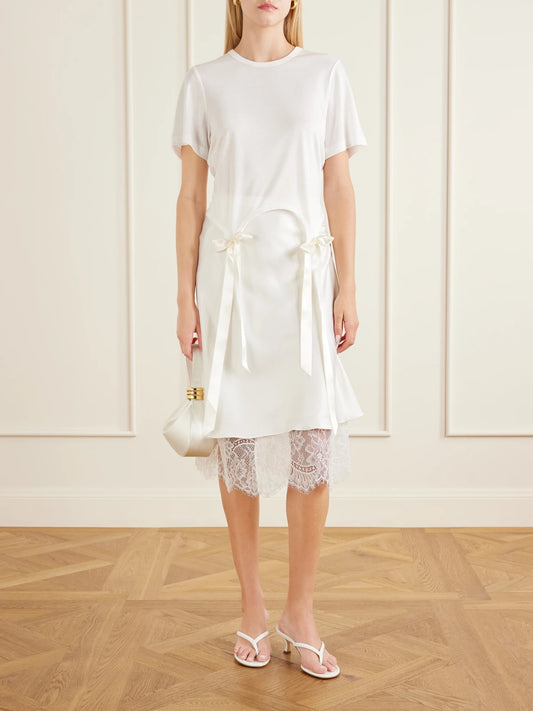 Image of a model wearing Tops. Product name - Bow-detailed Jersey T-shirt in Ivory colour by brand - Simone Rocha