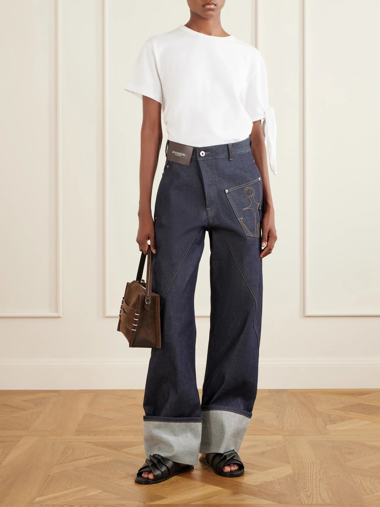 Image of Jeans. Product name - High-rise Embroidered Wide-leg Jeans in Dark denim colour by brand - JW Anderson